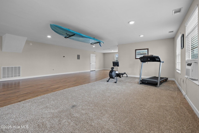 exercise area with recessed lighting, visible vents, baseboards, and carpet