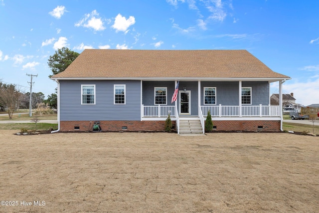 single story home with covered porch, roof with shingles, and crawl space