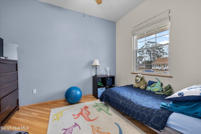 bedroom featuring wood finished floors