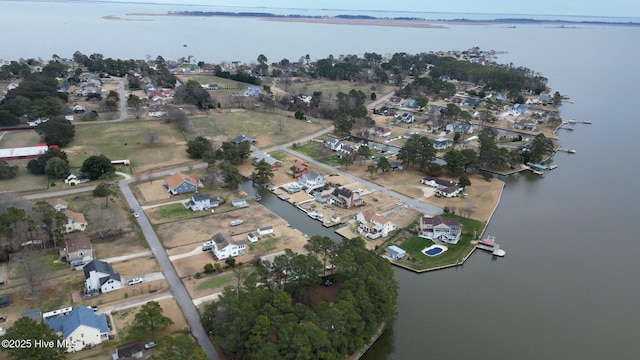 drone / aerial view with a water view and a residential view