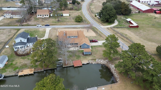 bird's eye view with a water view and a residential view