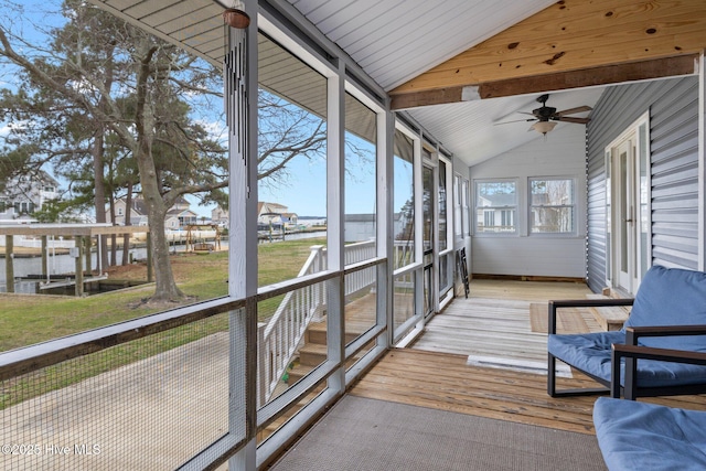 sunroom with lofted ceiling and ceiling fan