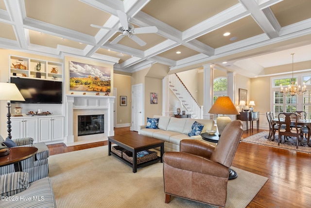 8904 Sound View Ct, Emerald Isle, NC 28594 - living room with stairs, coffered ceiling, wood finished floors, and a premium fireplace