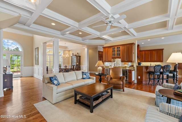 8904 Sound View Ct, Emerald Isle, NC 28594 - living area with coffered ceiling, wood finished floors, and ornate columns