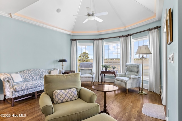 8904 Sound View Ct, Emerald Isle, NC 28594 - living area with ornamental molding, vaulted ceiling, wood finished floors, and a ceiling fan