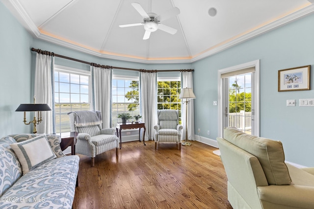8904 Sound View Ct, Emerald Isle, NC 28594 - living room with vaulted ceiling, baseboards, a ceiling fan, wood finished floors, and ornamental molding