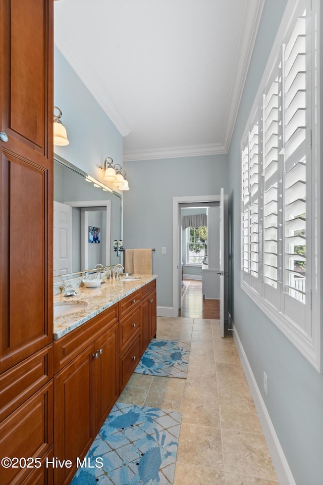 8904 Sound View Ct, Emerald Isle, NC 28594 - full bath with baseboards, ornamental molding, a sink, and double vanity