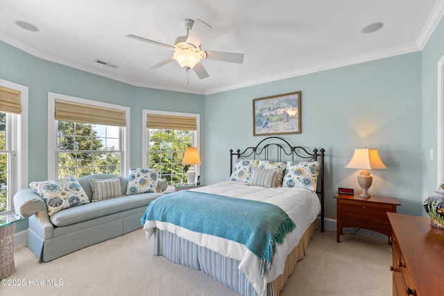 8904 Sound View Ct, Emerald Isle, NC 28594 - bedroom with light carpet, ornamental molding, multiple windows, and visible vents