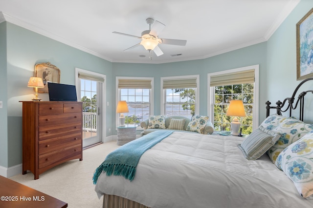 8904 Sound View Ct, Emerald Isle, NC 28594 - bedroom featuring baseboards, crown molding, light colored carpet, and access to outside
