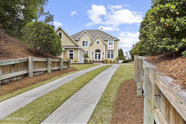 8904 Sound View Ct, Emerald Isle, NC 28594 - view of front of property featuring fence, a front lawn, and french doors