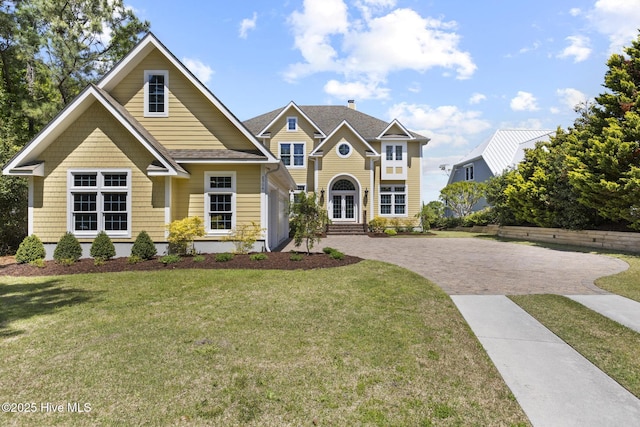 8904 Sound View Ct, Emerald Isle, NC 28594 - view of front of property with french doors, a front lawn, and decorative driveway