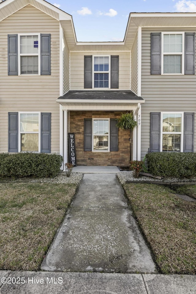 view of front facade featuring stone siding