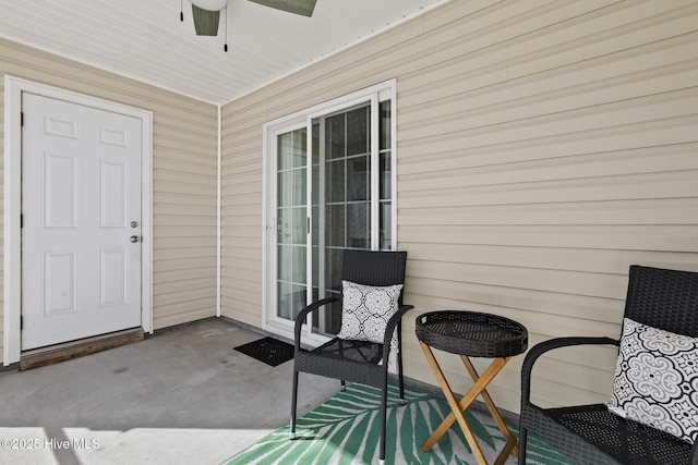 doorway to property featuring ceiling fan