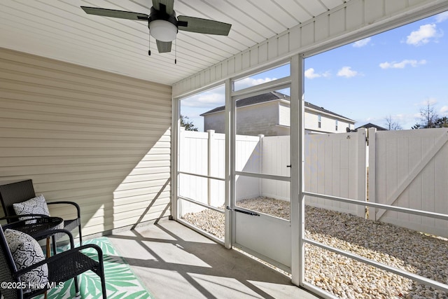 sunroom / solarium with ceiling fan