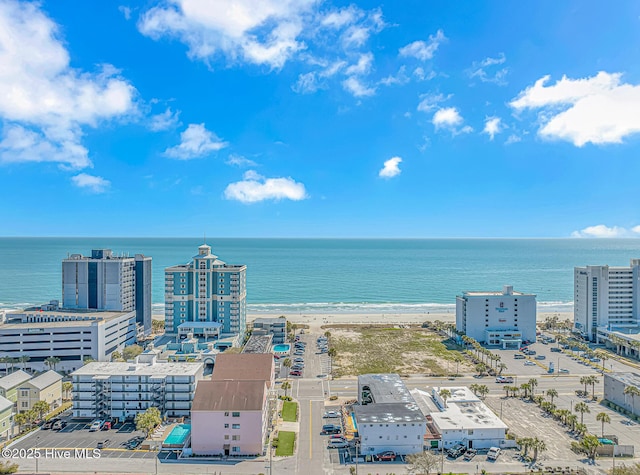 birds eye view of property featuring a city view and a water view