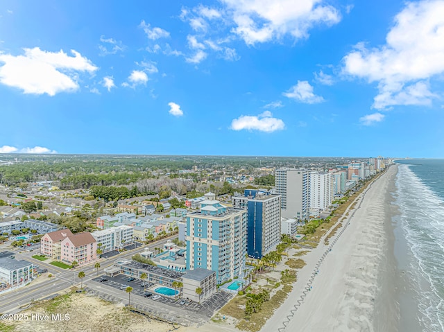 aerial view featuring a city view, a beach view, and a water view