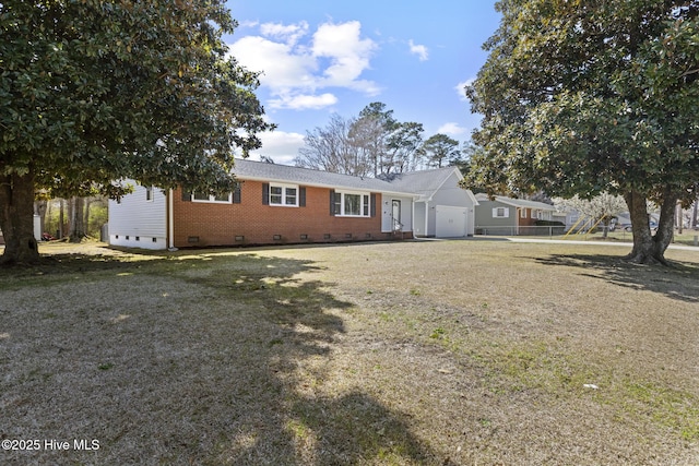 ranch-style house with an attached garage, brick siding, driveway, and crawl space