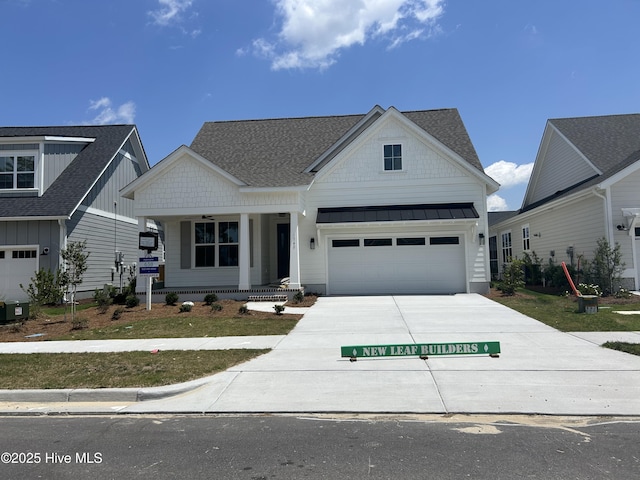 1340 Trisail Ter, Wilmington, NC 28412 - modern farmhouse featuring concrete driveway, covered porch, a standing seam roof, board and batten siding, and a shingled roof