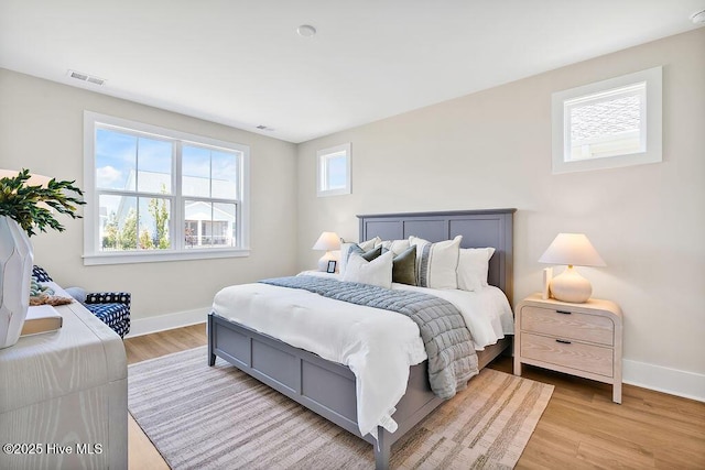 1340 Trisail Ter, Wilmington, NC 28412 - bedroom featuring baseboards and light wood finished floors