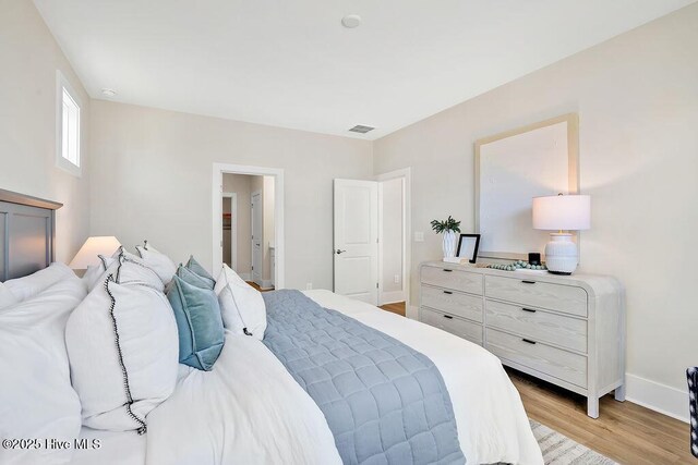 1340 Trisail Ter, Wilmington, NC 28412 - bedroom featuring light wood-style floors and baseboards