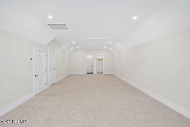 1340 Trisail Ter, Wilmington, NC 28412 - empty room featuring lofted ceiling, attic access, light carpet, recessed lighting, and baseboards