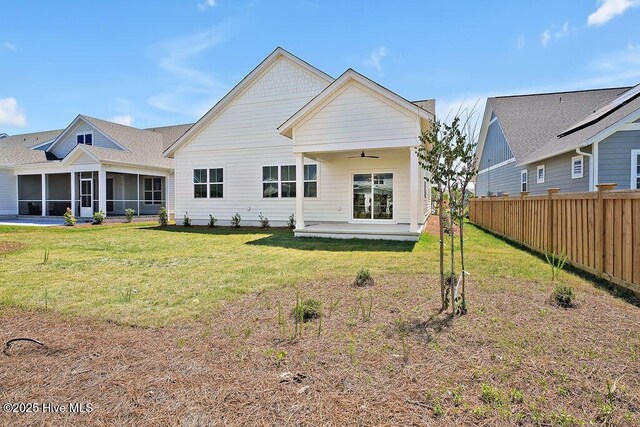1340 Trisail Ter, Wilmington, NC 28412 - back of property with a ceiling fan, a sunroom, and a patio