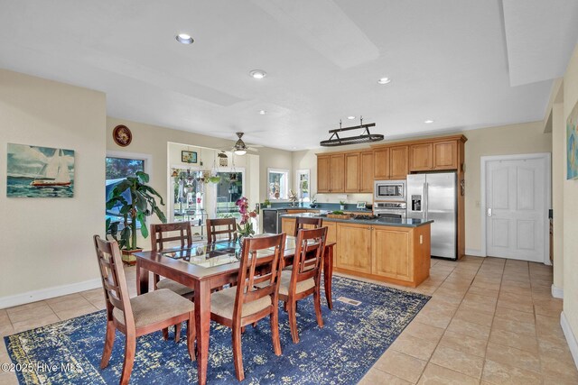 dining room featuring light tile patterned flooring, recessed lighting, and baseboards