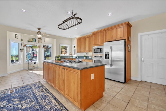 dining room featuring a ceiling fan, light tile patterned floors, recessed lighting, and baseboards