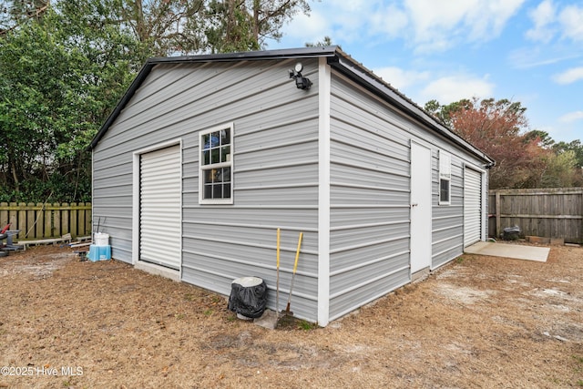 garage featuring fence