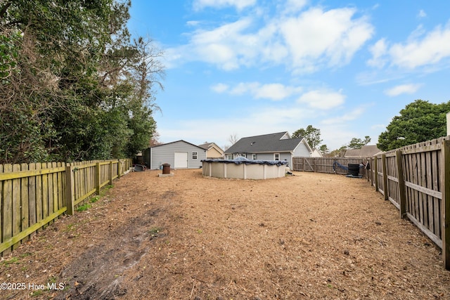 view of yard with a fenced in pool and a fenced backyard