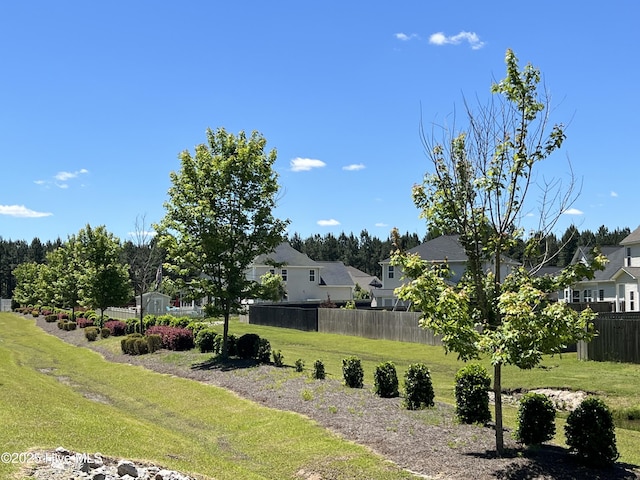 view of yard with a residential view and fence