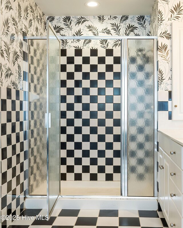 bathroom with vanity and a shower stall