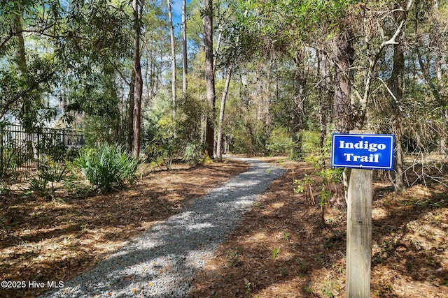 view of street featuring a wooded view