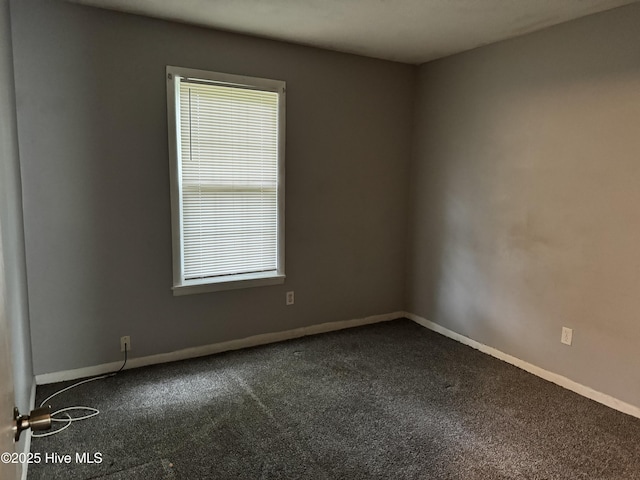 2604 Robeson St, Wilmington, NC 28405 - empty room featuring dark carpet and baseboards