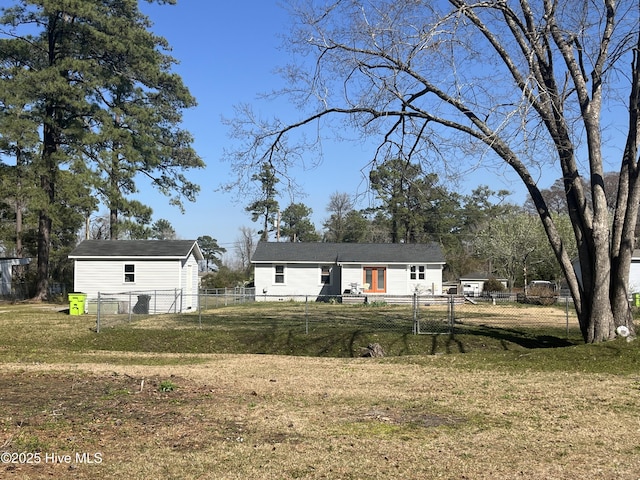 view of front of house with fence private yard and a front lawn