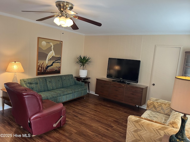 living area with wood finished floors, ceiling fan, and crown molding