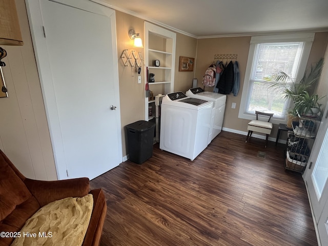 laundry area with built in shelves, independent washer and dryer, ornamental molding, dark wood-style floors, and laundry area