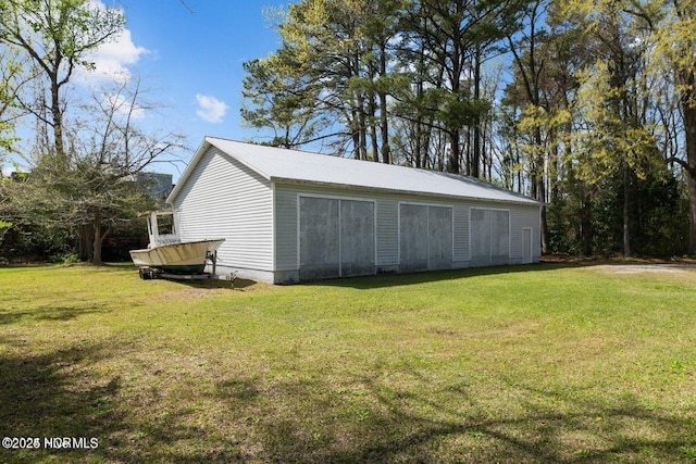 view of pole building with a yard