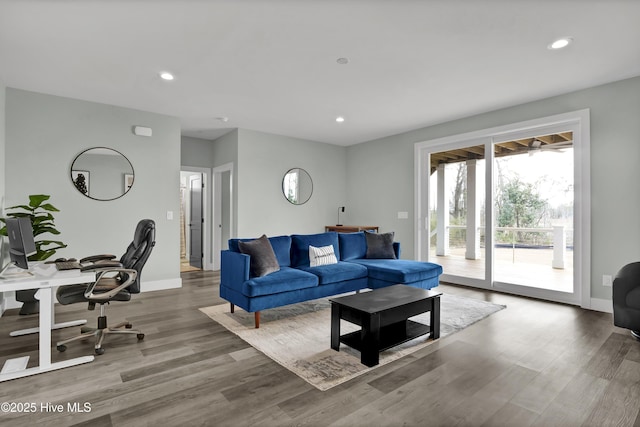 living area featuring recessed lighting, wood finished floors, and baseboards