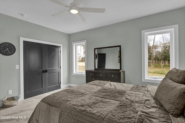 bedroom with baseboards and a ceiling fan