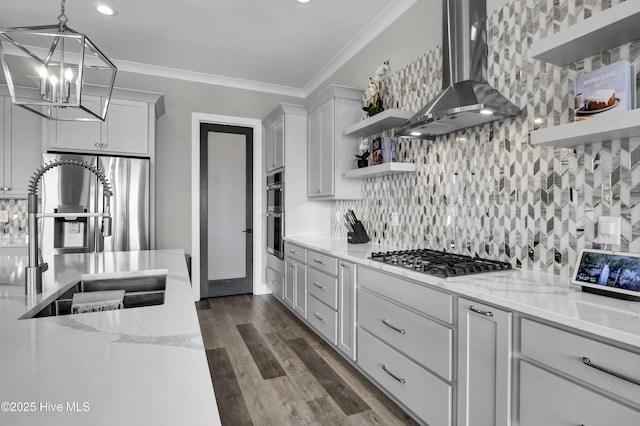 kitchen featuring open shelves, a sink, appliances with stainless steel finishes, crown molding, and wall chimney range hood