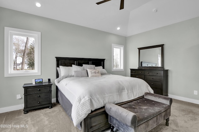 carpeted bedroom with recessed lighting, multiple windows, baseboards, and lofted ceiling