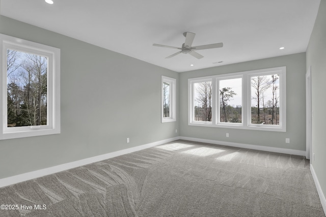 carpeted spare room featuring recessed lighting, baseboards, and ceiling fan