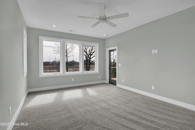 carpeted spare room with recessed lighting, baseboards, and a ceiling fan