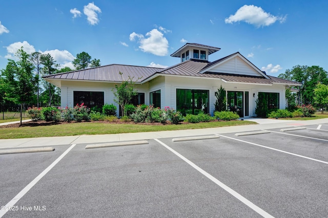 view of property featuring uncovered parking