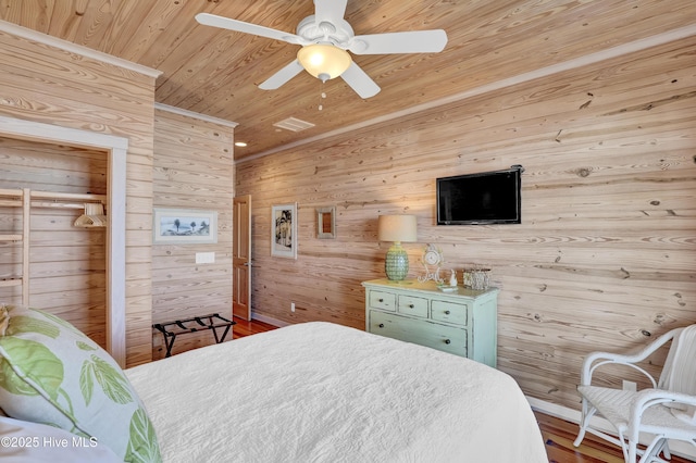 bedroom featuring wooden ceiling and a ceiling fan