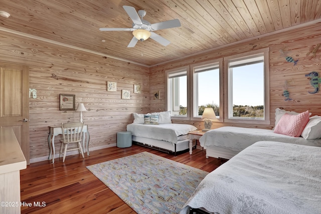 bedroom featuring hardwood / wood-style floors, wood ceiling, baseboards, and ceiling fan