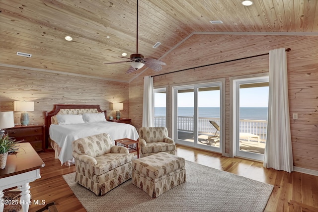 bedroom featuring a water view, lofted ceiling, access to exterior, and wooden ceiling