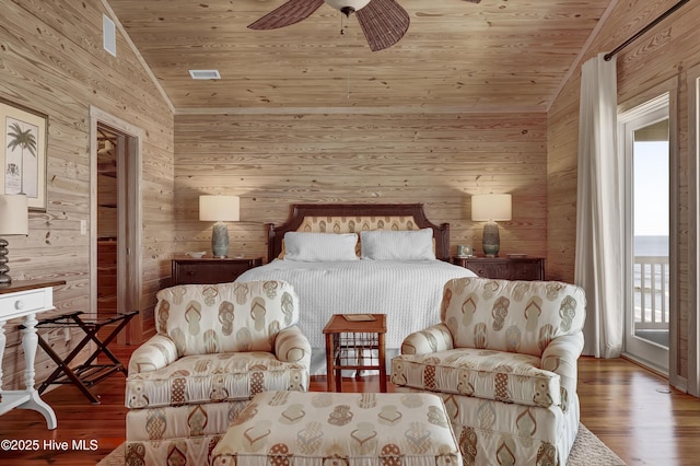 bedroom with wooden ceiling, access to outside, wood finished floors, and lofted ceiling