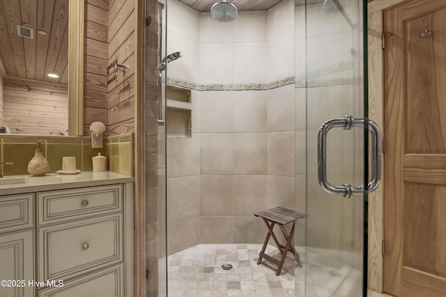 full bathroom with wood ceiling, a stall shower, and vanity